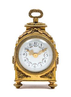 * A French Gilt Bronze Carriage Clock Height 6 inches.