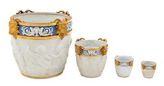 * Four Sevres Style Parcel Gilt Bisque Porcelain Jardinieres Height of tallest 10 inches.