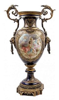 * A Sevres Style Gilt Bronze Mounted Porcelain Urn Height 32 inches.