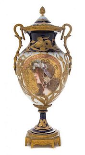 * A Sevres Style Gilt Bronze Mounted Porcelain Urn Height 17 inches.