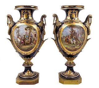 * A Pair of Sevres Gilt Bronze Mounted Porcelain Urns Height 30 inches.