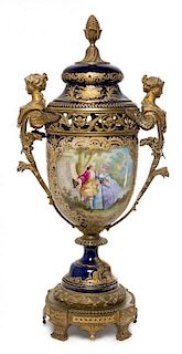 * A Sevres Gilt Bronze Mounted Porcelain Urn Height 29 1/2 inches.