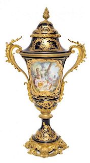 * A Sevres Gilt Bronze Mounted Porcelain Urn Height 26 1/4 inches.