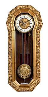 A Continental Giltwood Wall Clock Height 33 inches.