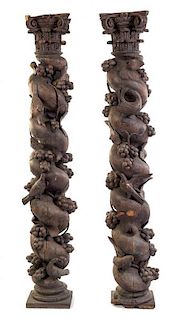 * A Pair of Continental Carved Columns Height 75 1/2 inches.