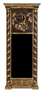 * An Italian Carved and Parcel Gilt Pier Mirror Height 76 1/2 x width 32 1/2 inches.