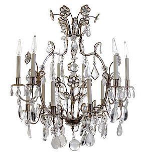 A Silvered Metal, Glass and Rock Crystal Twelve-Light Chandelier Height 34 x diameter 27 inches.