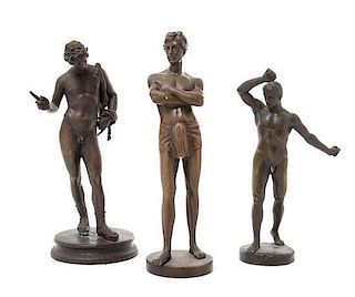* A Group of Three Bronze Figures Height of tallest 10 inches.