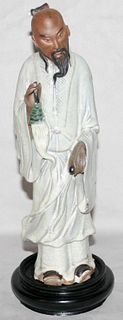 CHINESE GLAZED POTTERY FIGURE OF A MAN