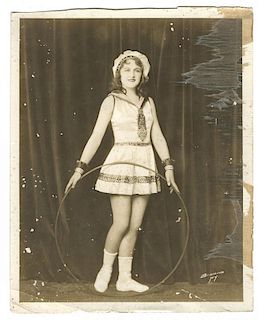 Group of Eleven Photographs and Postcards of Female Circus Performers.
