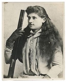 Two Photos and Booklet Related to Annie Oakley.