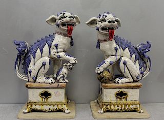Pair of Large Glazed Pottery Foo Dogs.