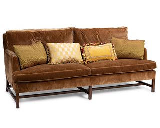 A contemporary velvet sofa