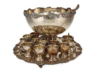 A silver-plated punchbowl with tray