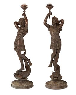 A pair of bronze figural floor lamps