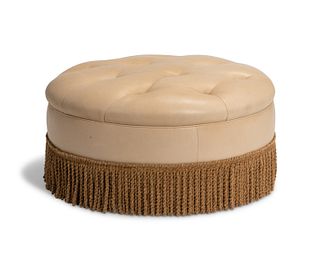 A tufted leather pouf cushion
