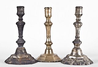 A lot of three 18th century brass candlesticks