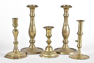 A lot of five 18th and 19th century brass candlesticks
