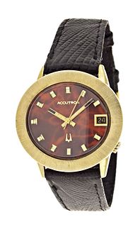 A gold Bulova Accutron wrist watch