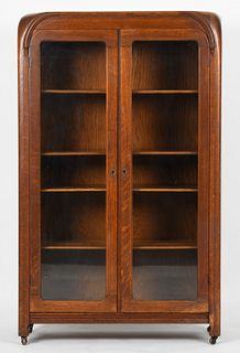 An Art Deco carved oak bookcase