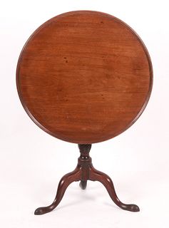 A George III carved mahogany tilt-top tea table