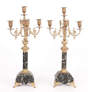 A pair of French gilt bronze and marble candelabra