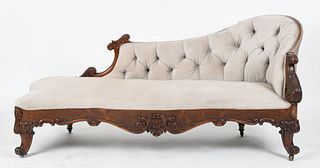 A Victorian carved rosewood chaise lounge