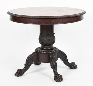 A Classical style carved mahogany center table