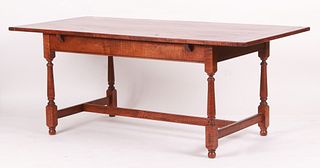 A William and Mary style tiger maple dining table
