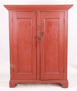 An American country red painted two door cupboard