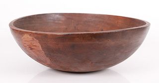 A large primitive maple turned mixing bowl