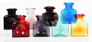 Eight Blenko colored glass water bottles
