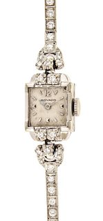 A lady's Movado diamond set gold wrist watch
