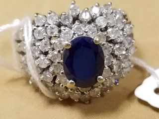 14K RING W/SAPPHIRE CENTER SURROUNDED BY DIAMONDS