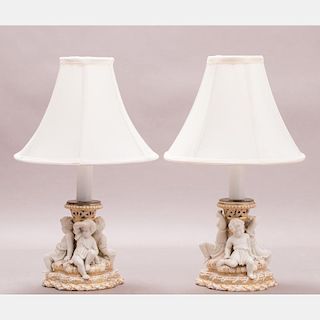 A Pair of Continental Porcelain Figural Lamps, 20th Century.
