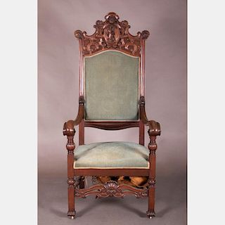 A Continental Carved Walnut Armchair, 19th Century.