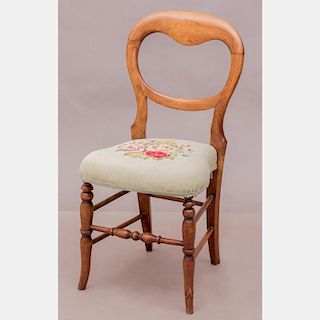 A Victorian Walnut Side Chair with Needlework Seat, 19th Century.