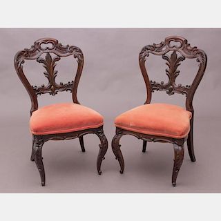 A Pair of Victorian Elaborately Carved Rosewood Side Chairs, 19th Century.
