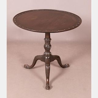 A Chippendale Heavily Carved Mahogany Tilt Top Tea Table, 18th Century.