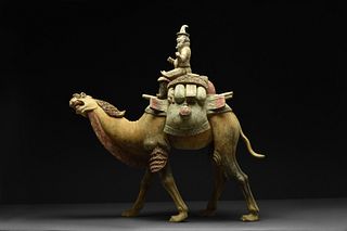 LARGE CHINESE TANG DYNASTY TERRACOTTA CAMEL WITH FOREIGN RIDER