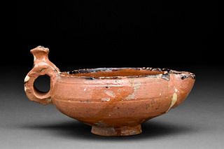 ISLAMIC TERRACOTTA SPOUTED VESSEL DECORATED WITH PEARL AND LEAF MOTIFS