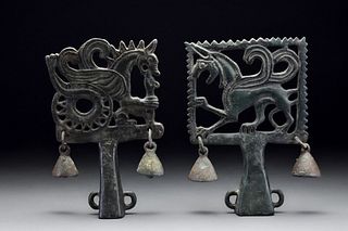 A PAIR OF SCYTHIAN BRONZE CHARIOT TERMINALS WITH GRIFFIN