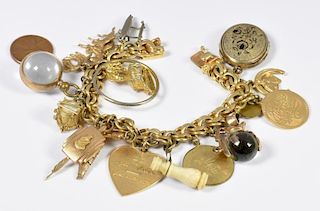 14K Charm Bracelet, drum, heart, horseshoe, etc.