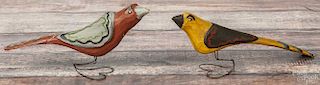 Daniel Strawser, two carved and painted birds, initialed and dated '86, on wire heart-form bases