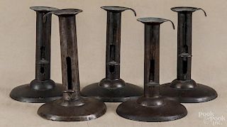 Five tin hogscraper candlesticks, 19th c., tallest - 5 1/2''.