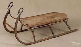 Child's sled, 19th c., with cast iron swans neck terminals, 37'' l.