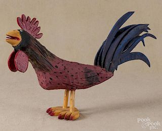 Carved and painted outsider art rooster, signed Miguel Rodriguez 2-2-2000, 15'' h., 26'' l.