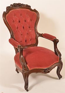 Victorian Walnut Carved and Molded Arm Chair.