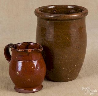 Pennsylvania redware milk pitcher, 19th c., with manganese splotching, 4 1/2'' h.