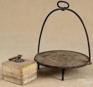 Cast iron hanging griddle, 19th c., 14 1/2'' dia., together with a marble door stop, 4 1/2'' h.